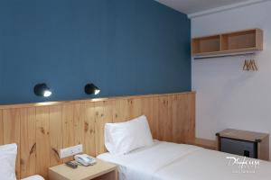 Postel nebo postele na pokoji v ubytování De House Hotel