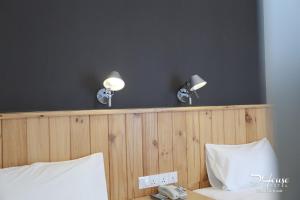 Postel nebo postele na pokoji v ubytování De House Hotel