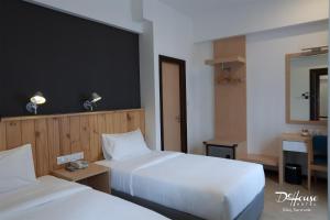 Postel nebo postele na pokoji v ubytování De House Hotel