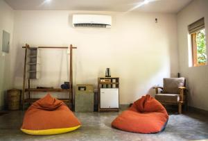 a room with two bean bags on the floor at The Spice Trail in Arugam Bay