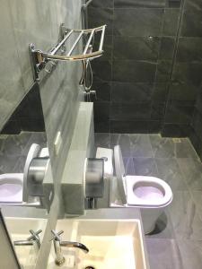 A bathroom at FARAWAY SUITES