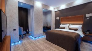 Postel nebo postele na pokoji v ubytování Midtown Hotel Baku