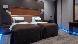 Postel nebo postele na pokoji v ubytování Midtown Hotel Baku