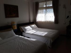 Postel nebo postele na pokoji v ubytování Star 101 Guest House
