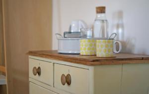 a kitchen counter with two mugs on top of it at Westbury Cross House Bed & Breakfast in Westbury-sub-Mendip