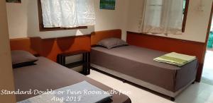Postel nebo postele na pokoji v ubytování Haad Salad Resort