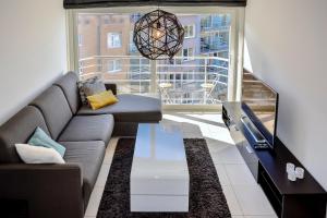 Ruang duduk di Lumina Suite Seaview & Garage