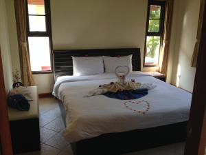 A bed or beds in a room at Paradis Villa B3