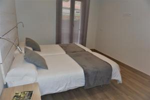 Postel nebo postele na pokoji v ubytování Apartamentos La Playina