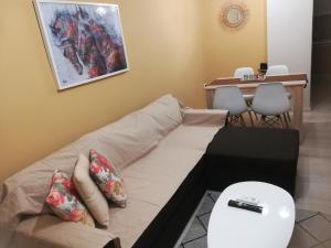 a living room with a couch and a table at Central Apartment in Thessaloniki