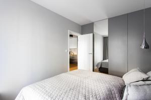 Posteľ alebo postele v izbe v ubytovaní Apartament Gardenia Sea&Sun DZIWNÓW PRZY PLAŻY