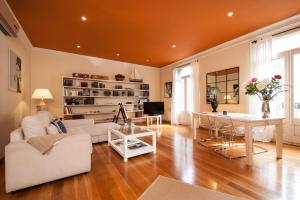 a living room with a couch and a table at BCN Apartments 41 in Barcelona