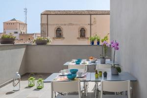 Balkón nebo terasa v ubytování D-Home Ortigia