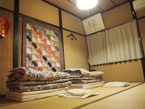 Postel nebo postele na pokoji v ubytování Kakure-Yado Yuji-inn