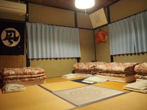 Postel nebo postele na pokoji v ubytování Kakure-Yado Yuji-inn