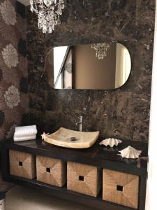 a bathroom with a sink and a mirror at Sliema La Loggia Suites in Sliema +52 photos
