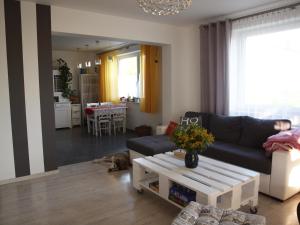 a living room with a couch and a table at Wakacje u Babci Krysi in Górno