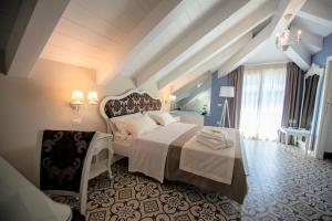 Voodi või voodid majutusasutuse Sui Generis Tropea Luxury Rooms toas