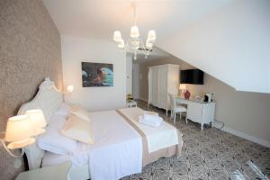 Voodi või voodid majutusasutuse Sui Generis Tropea Luxury Rooms toas