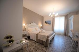 Voodi või voodid majutusasutuse Sui Generis Tropea Luxury Rooms toas
