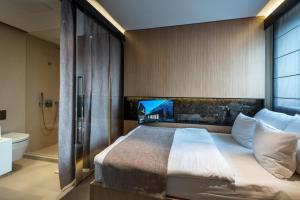 Llit o llits en una habitació de Ilonn Hotel