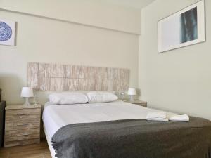 Posteľ alebo postele v izbe v ubytovaní Guajara Modern Studio