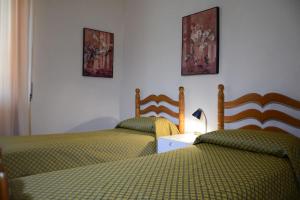 A bed or beds in a room at Villa Orrì