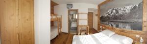 Postel nebo postele na pokoji v ubytování Albergo Soldanella
