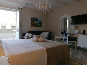 Voodi või voodid majutusasutuse Sui Generis Tropea Luxury Rooms toas