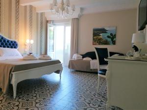 Voodi või voodid majutusasutuse Sui Generis Tropea Luxury Rooms toas