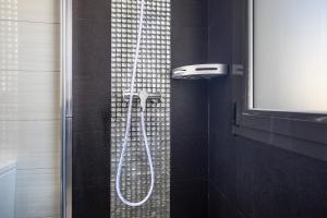Koupelna v ubytování Apartamento Atico Real Suites