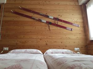 Postel nebo postele na pokoji v ubytování Albergo Soldanella