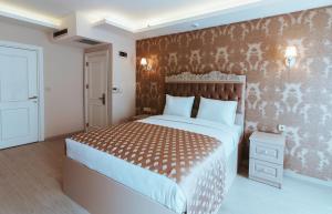 A bed or beds in a room at Istanroom by Keo