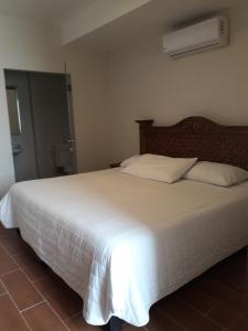 Postel nebo postele na pokoji v ubytování Hotel Purisima Concepción