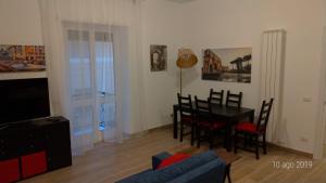 a living room with a table and a dining room at Casa di Rosita in Rome