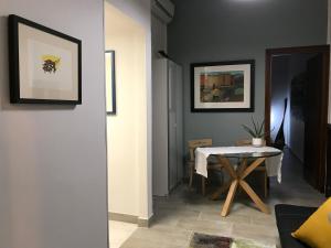 a living room with a table and a white table at Casitta in Mascali