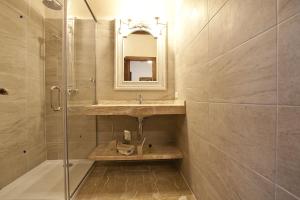 a bathroom with a sink and a shower with a mirror at Agroturismo Sa Vinya des Convent in Inca +68 photos