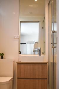 a bathroom with a sink and a mirror at Kabuki Mt Buller in Mount Buller