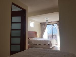 Postel nebo postele na pokoji v ubytování Hotel La Posada de Francisca