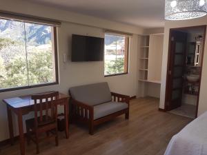 TV a/nebo společenská místnost v ubytování Hotel La Posada de Francisca