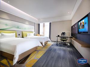 Μια τηλεόραση ή/και κέντρο ψυχαγωγίας στο Hampton by Hilton Guangzhou Dongxiaonan