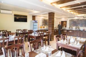 Veitingastaður eða matsölustaður á Ganapati Airport Hotel