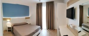 TV a/nebo společenská místnost v ubytování Almalux Jesolo Wellness & Spa 3 stelle superior