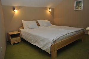 Posteľ alebo postele v izbe v ubytovaní Sárvárfürdő Apartmanház + 31 fotografií