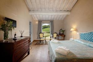 Кровать или кровати в номере Casanova di Neri Relais