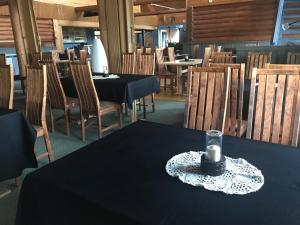 a table with a candle sitting on top of it at Hotelli Kolari in Kolari +21 photos