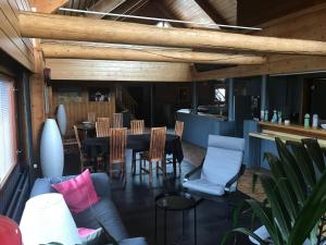 a dining room with a table and chairs at Hotelli Kolari in Kolari