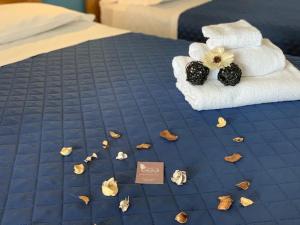 Postel nebo postele na pokoji v ubytování Albergo Papillon
