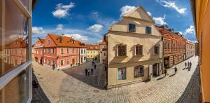 a view of a street in a city with buildings at Pension BLUME in Český Krumlov