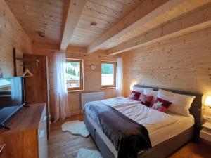 Voodi või voodid majutusasutuse Berghütte Murmele toas